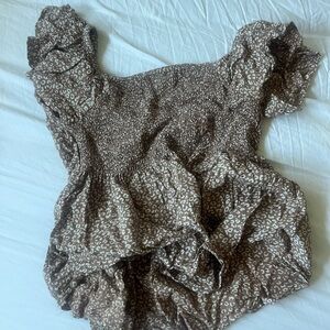 Super trendy cheetah print top that can go with any color or style pants